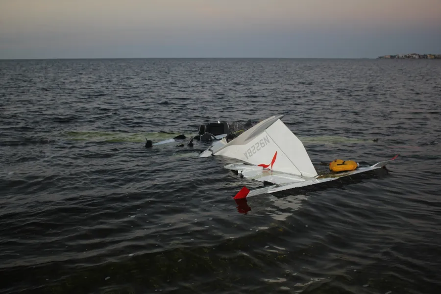 Inverted wreckage of N922BA floating in the Gulf of Mexico shortly after the accident, with the registration visible on the tail