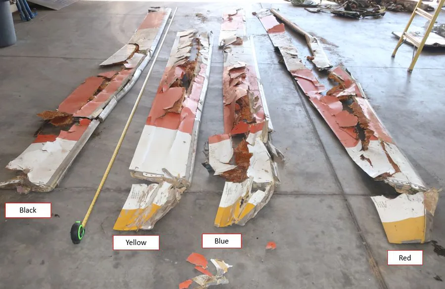 Recovered main rotor blades laid out for examination