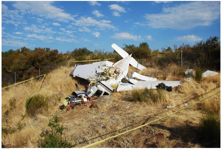 NTSB photo of the main wreckage, wider second view