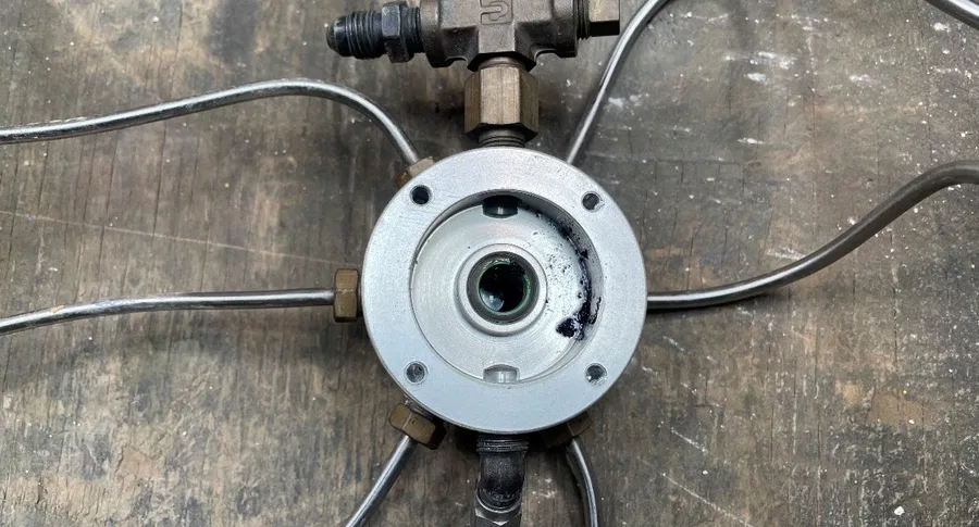 The disassembled fuel flow manifold assembly examined by investigators, which tested positive for water with SAR-GEL paste